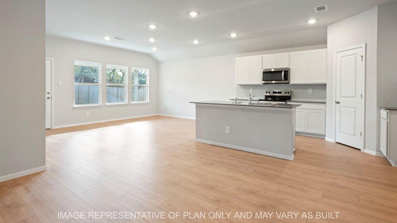 Easton open concept living area with light wood vinyl flooring
