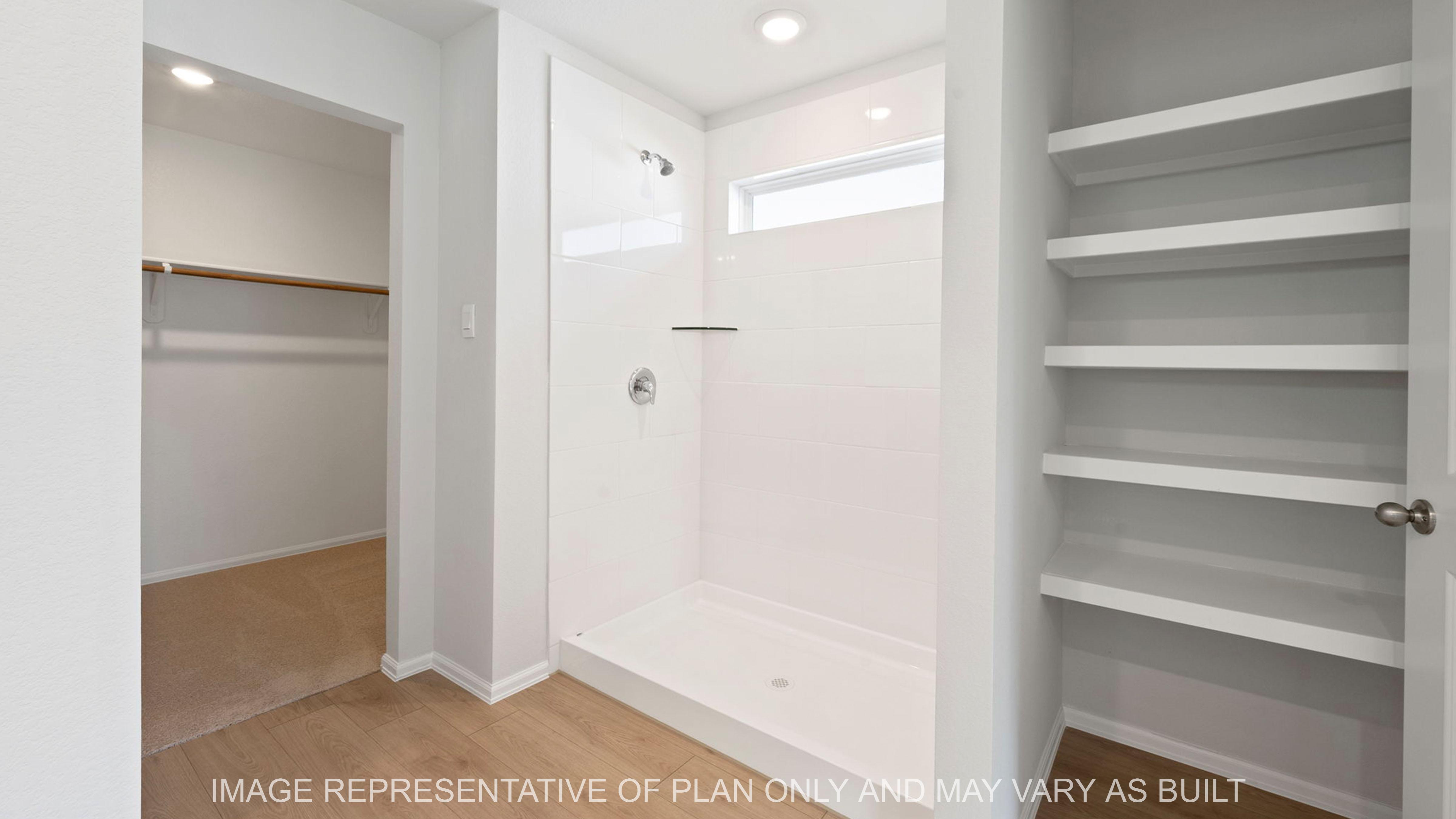 Easton open concept of primary bath with shower and closet