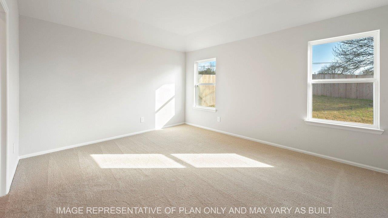 Easton primary bedroom with carpet and windows