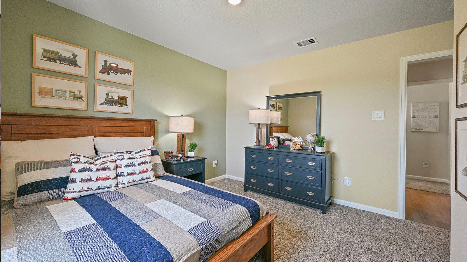 Whitetail Run Model Home secondary bedroom with carpet