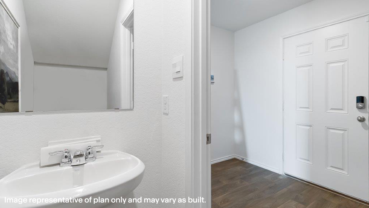 Franklin half bath with single vanity and view of entry way.