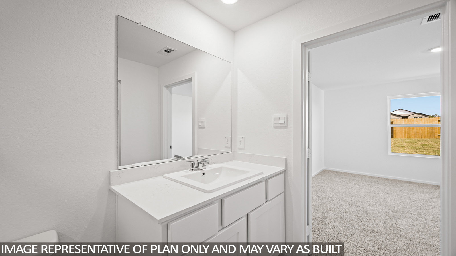 Archer primary bathroom with vanity sink and view of primary bedroom.
