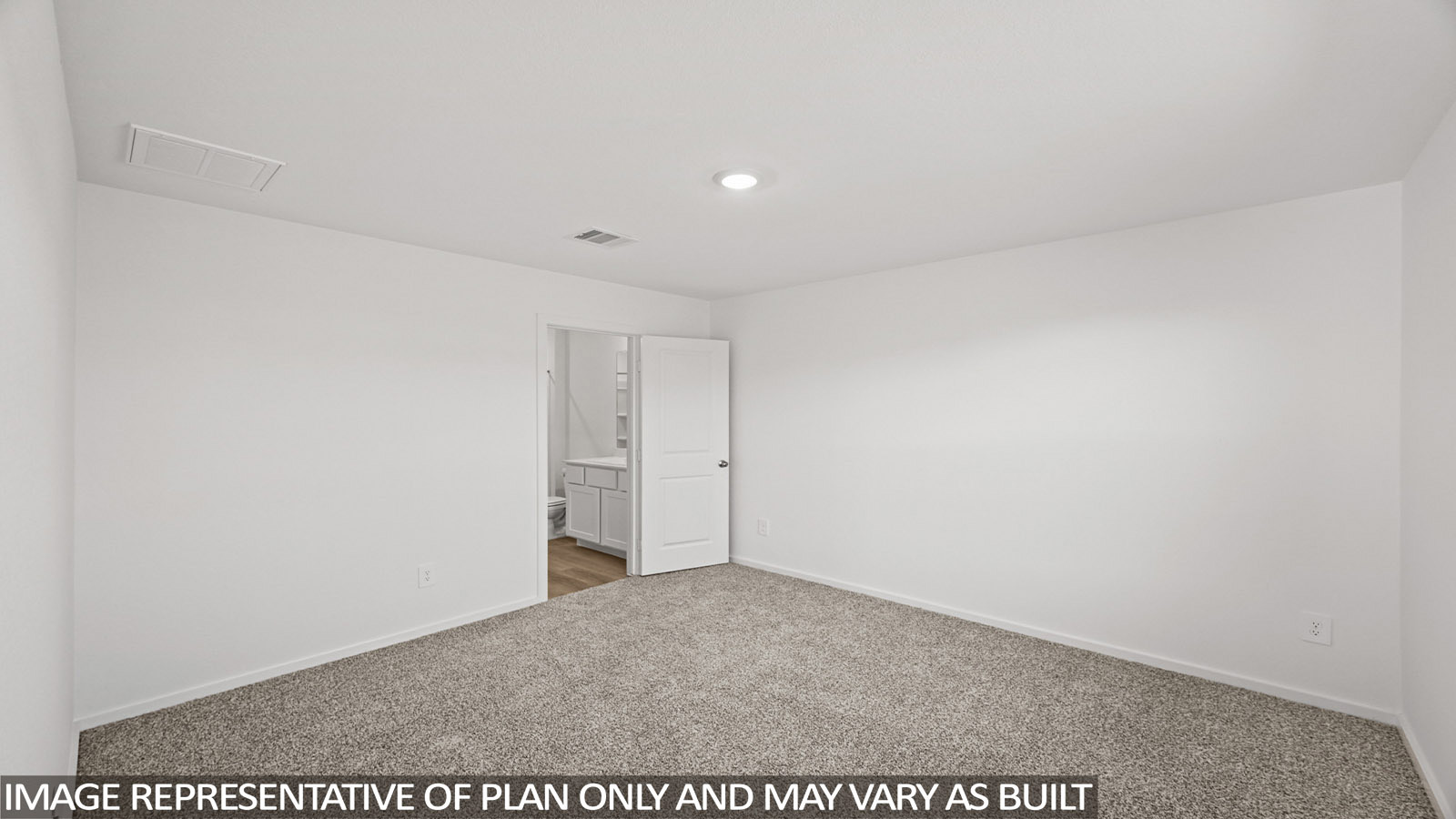 Archer primary bedroom with carpeted flooring and view of primary bathroom.