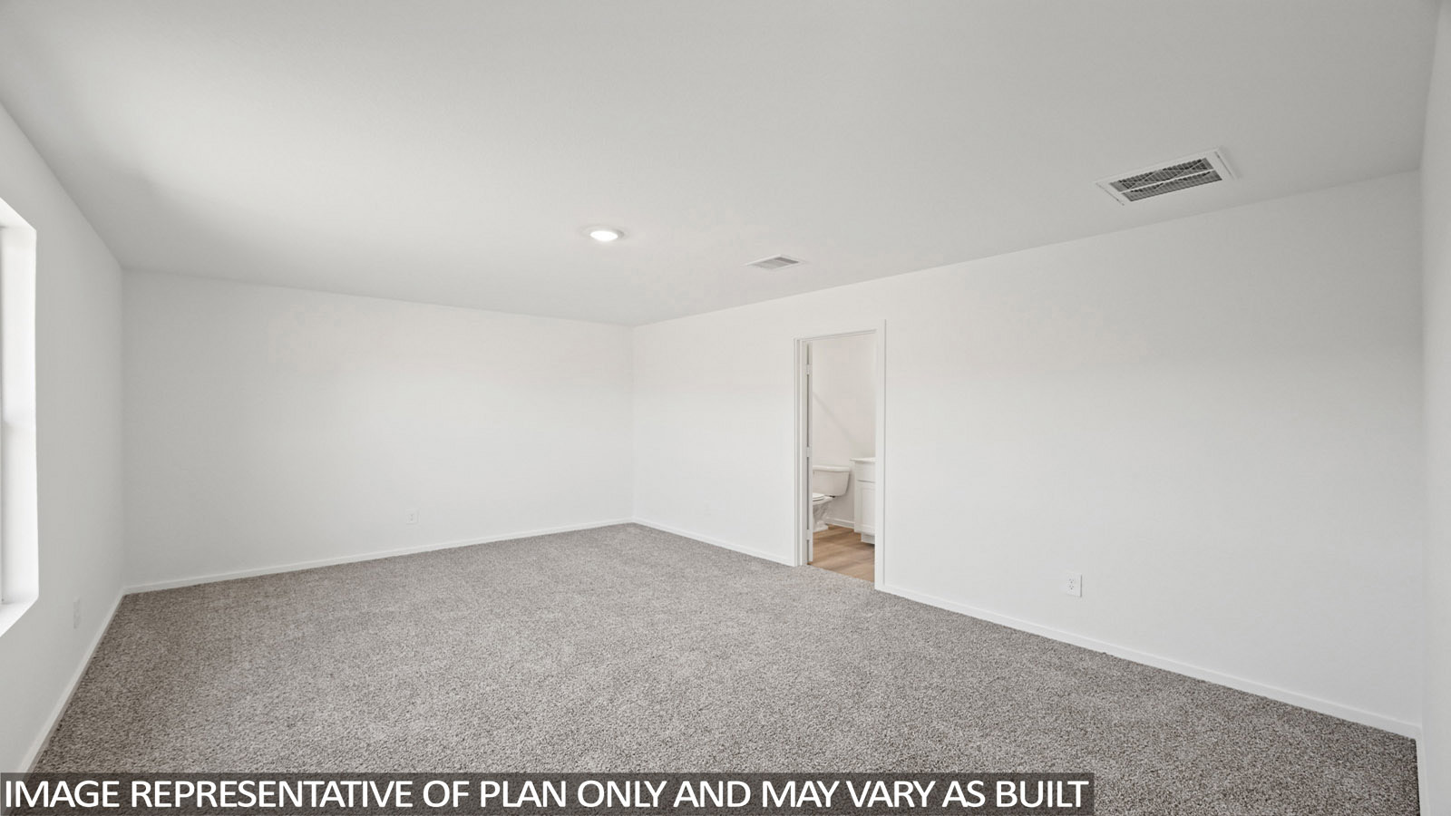 Callahan primary bedroom with carpeted flooring and view of primary bathroom.