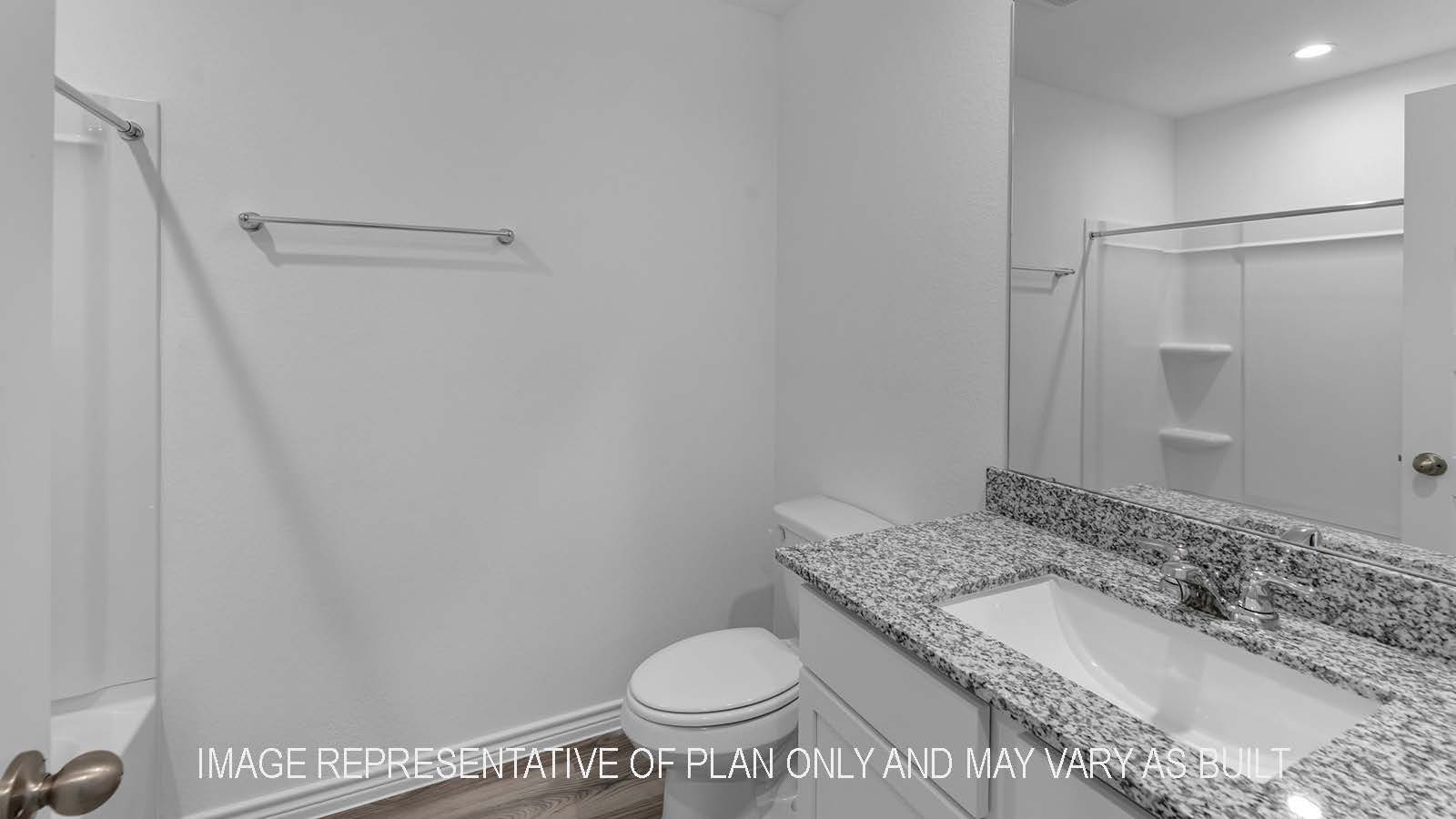 Denton secondary bathroom with granite countertops and shower/tub combo.