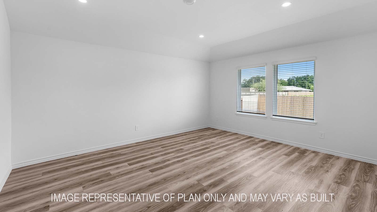 Denton living room with two windows to backyard.