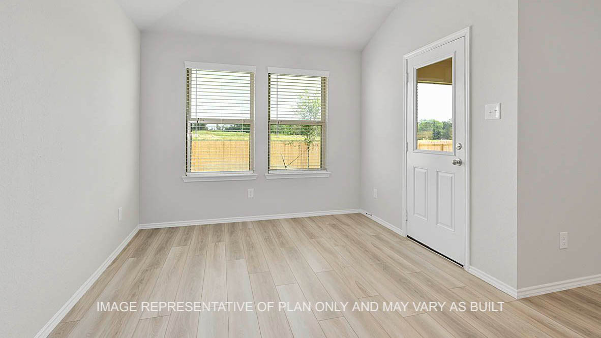 Fargo breakfast nook with windows, back door, and vinyl plank flooring.