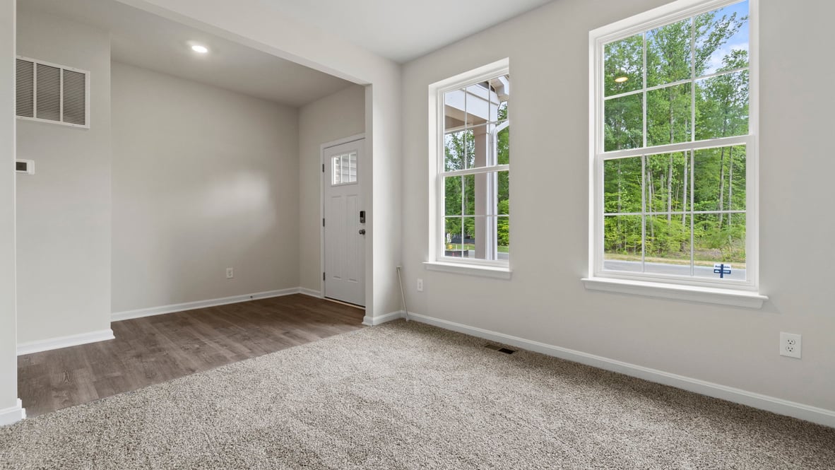 Walk into the foyer and find the flex room to your left