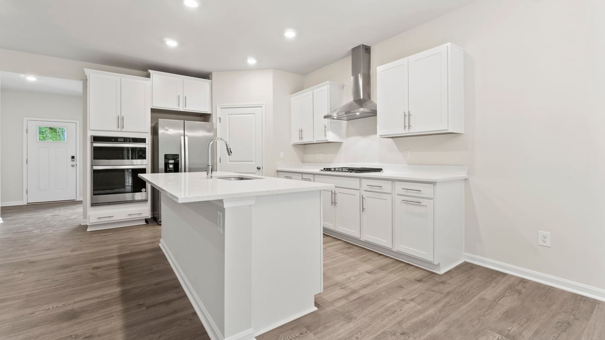 The kitchen features a large, modern island