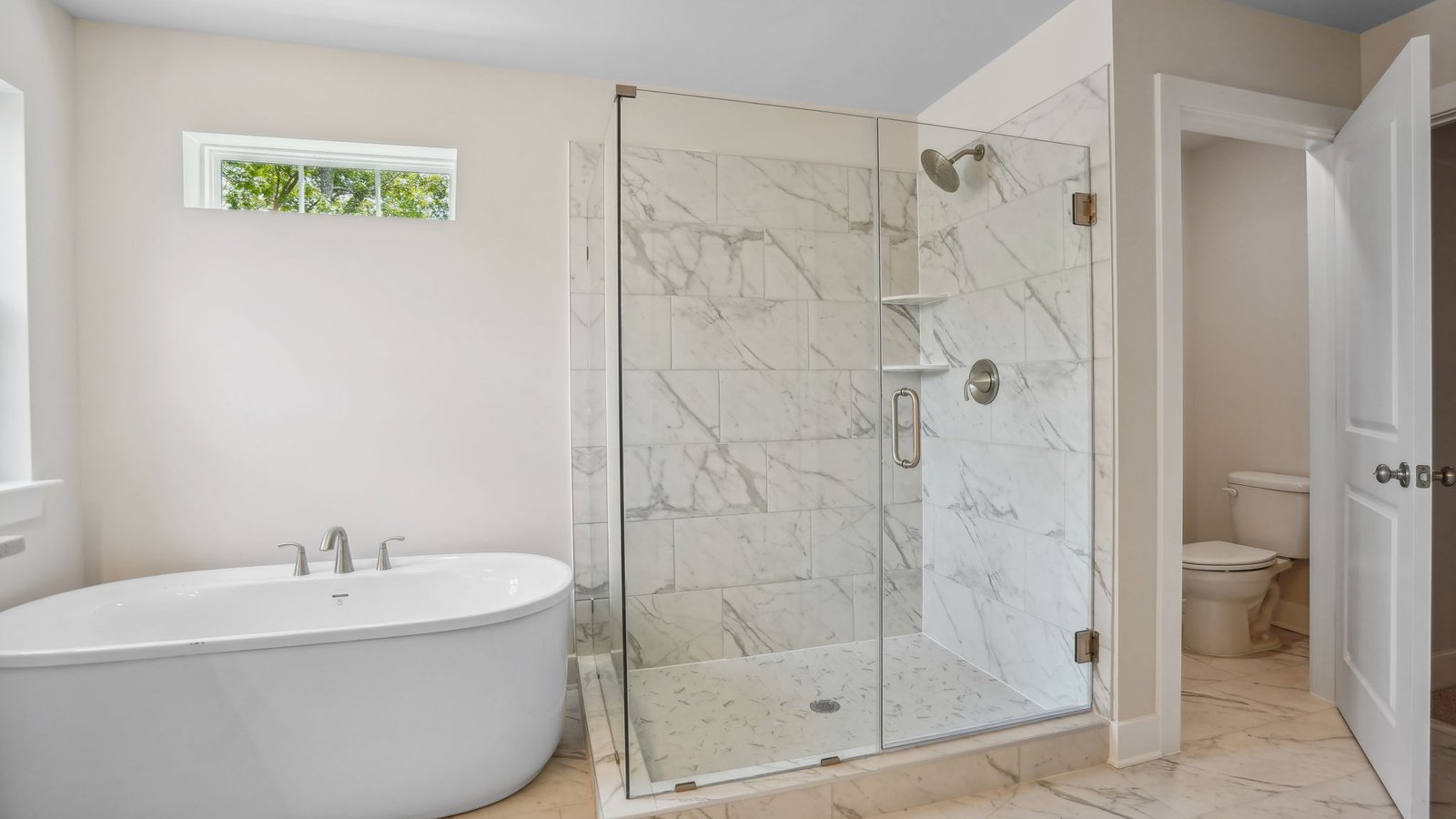 primary bath features a soaking tub and shower