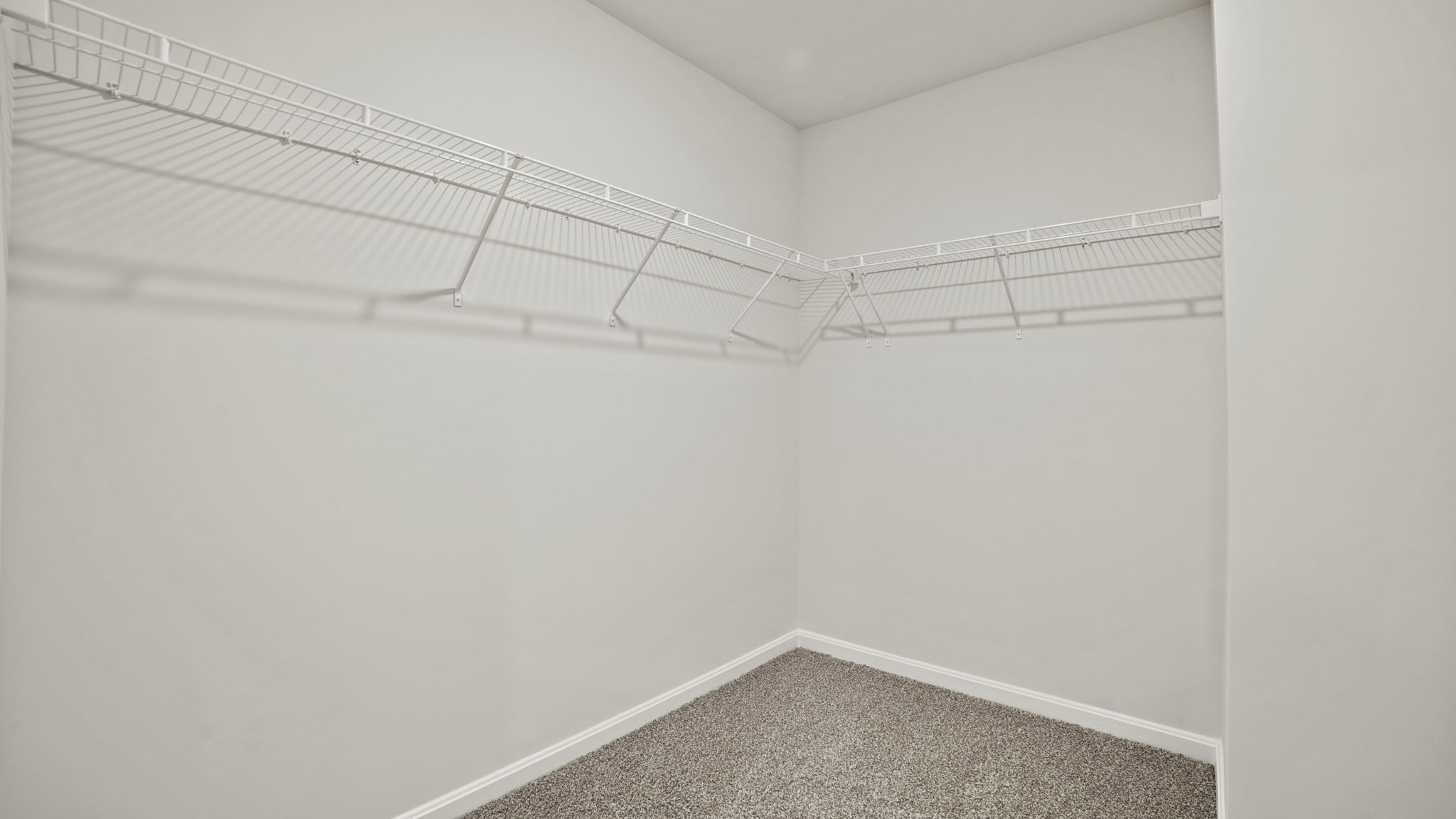 walk in closet with storage space