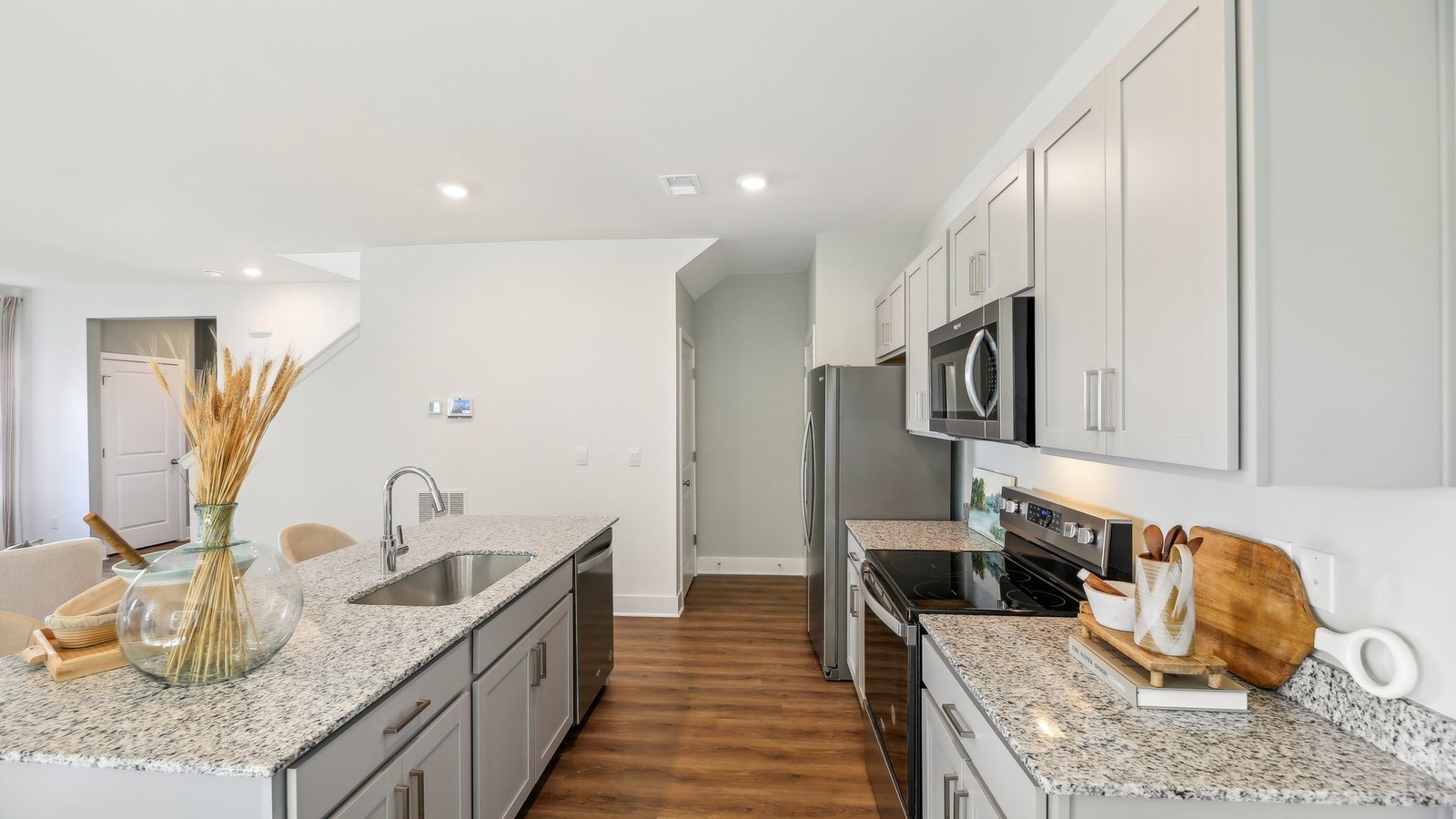 In the corner of the kitchen you will find a pantry and the stairs that lead to the basement