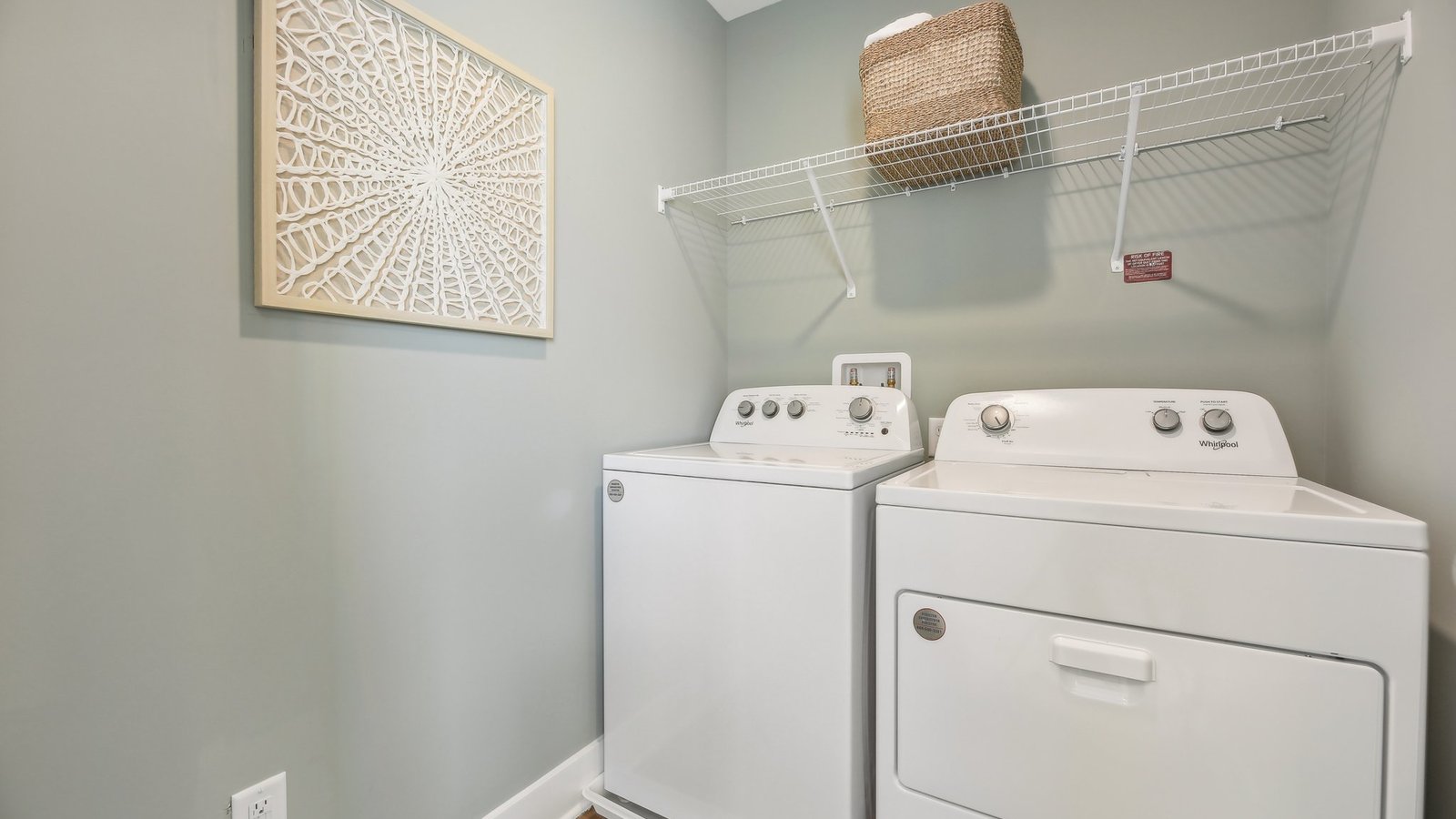 The laundry room is conveniently located upstairs