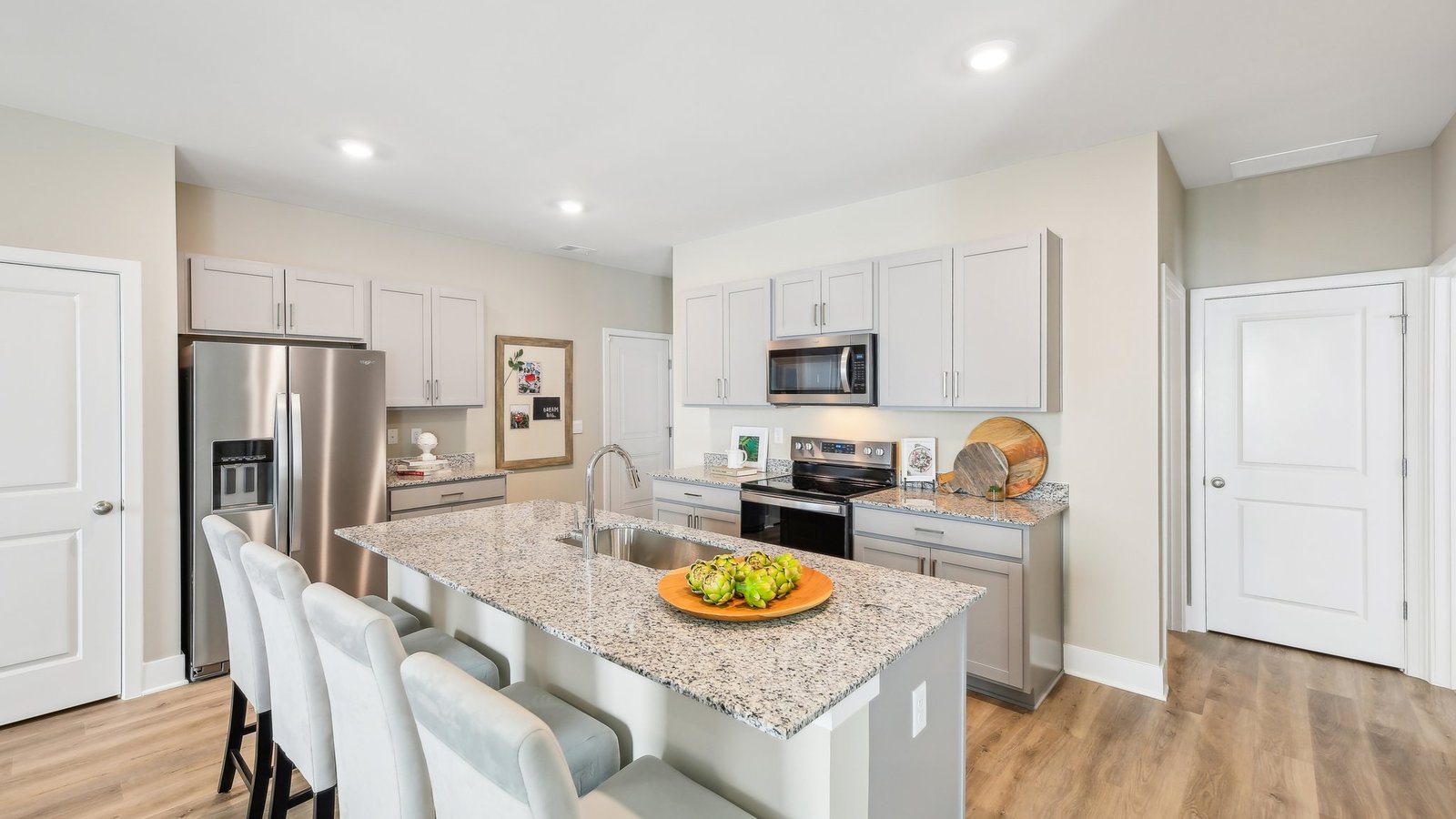 Large kitchen island with seating in a new construction home in Winchester, VA, designed for entertaining and everyday living.