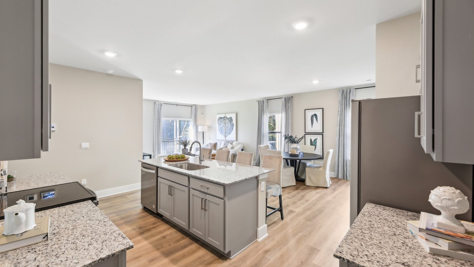 Gourmet kitchen in a new Winchester VA single-family home featuring a large island, stainless steel appliances, quartz countertops, and open-concept design.