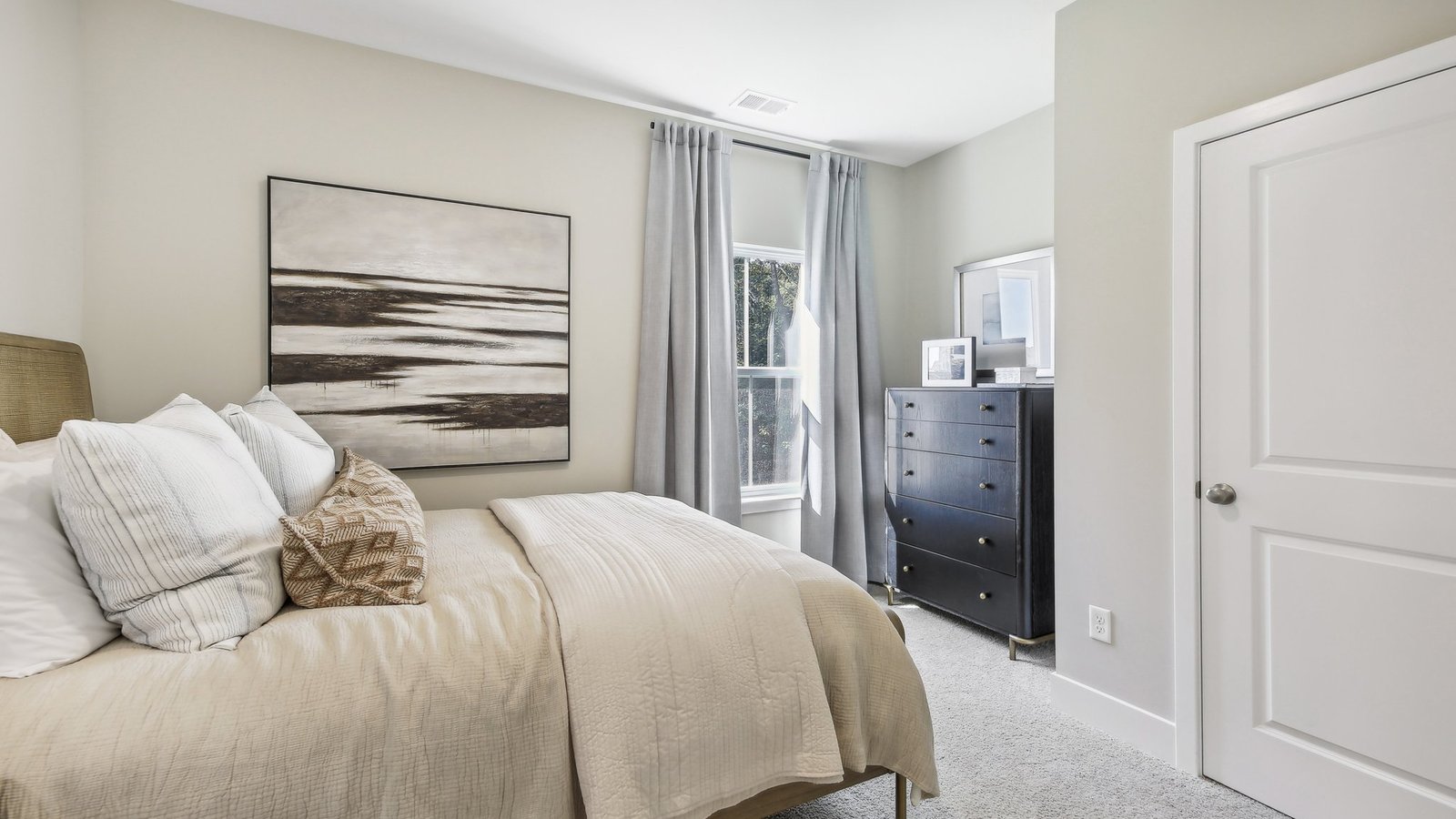 Comfortable secondary bedroom in a new construction home in Winchester, VA with bright windows and versatile living space.