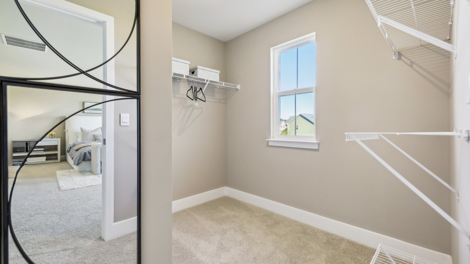 Generous walk-in closet in a new single-family home in Winchester, VA offering ample storage and organization space.