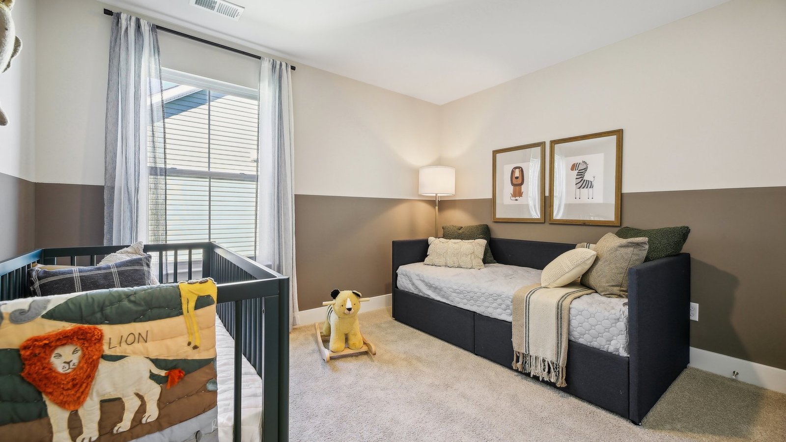 Comfortable secondary bedroom in a new construction home in Winchester, VA with bright windows and versatile living space.