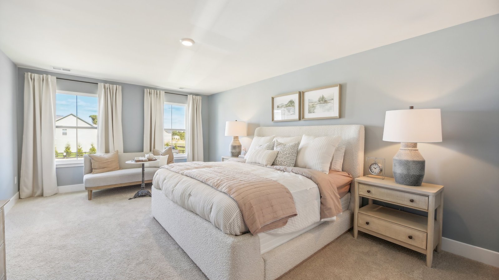 primary bedroom with king bed and seating area