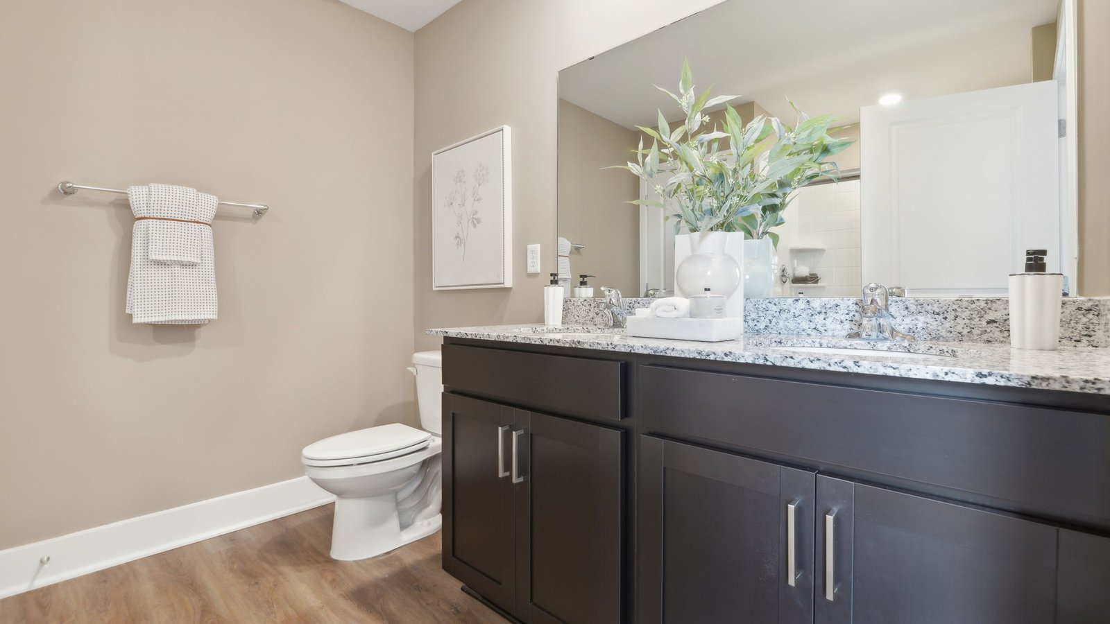 primary full bathroom with walk in shower and dual sink vanity