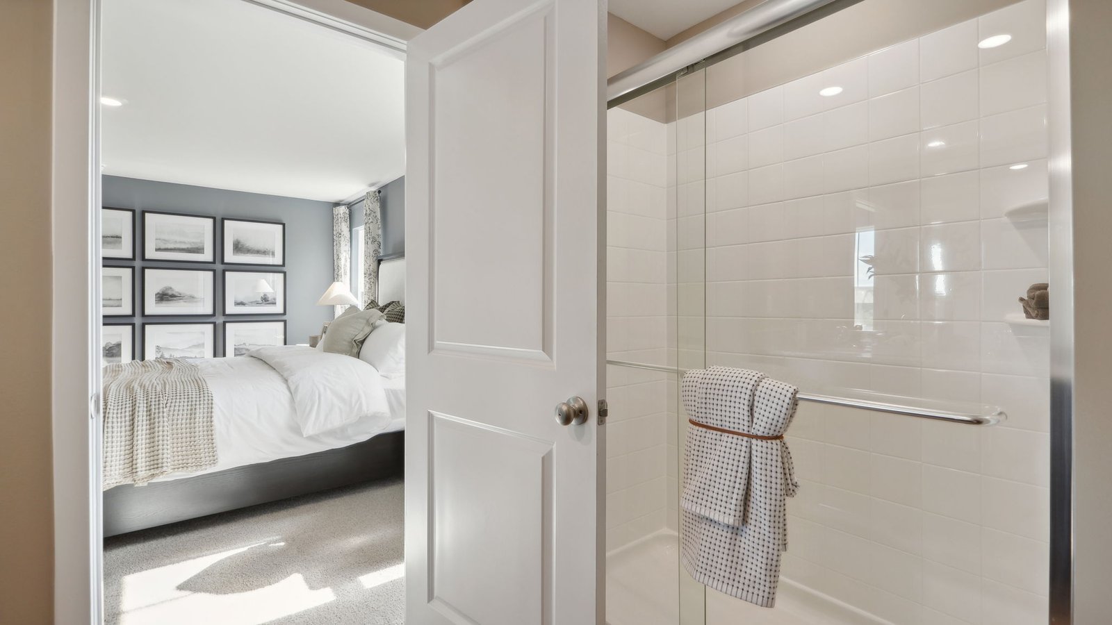 primary full bathroom with walk in shower and dual sink vanity