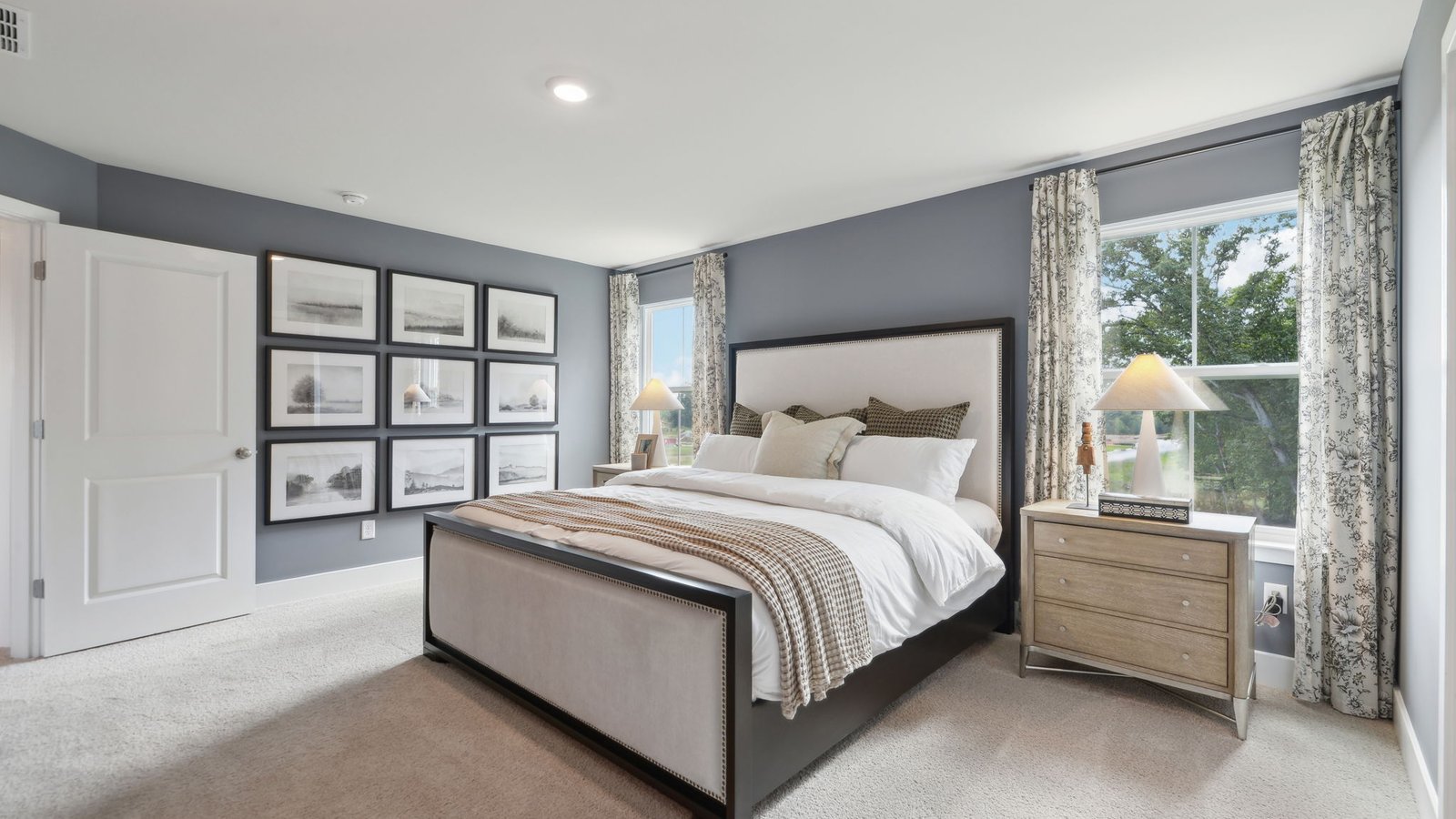 Spacious primary bedroom in a new home in Winchester, VA featuring abundant natural light, modern finishes, and a relaxing retreat atmosphere.