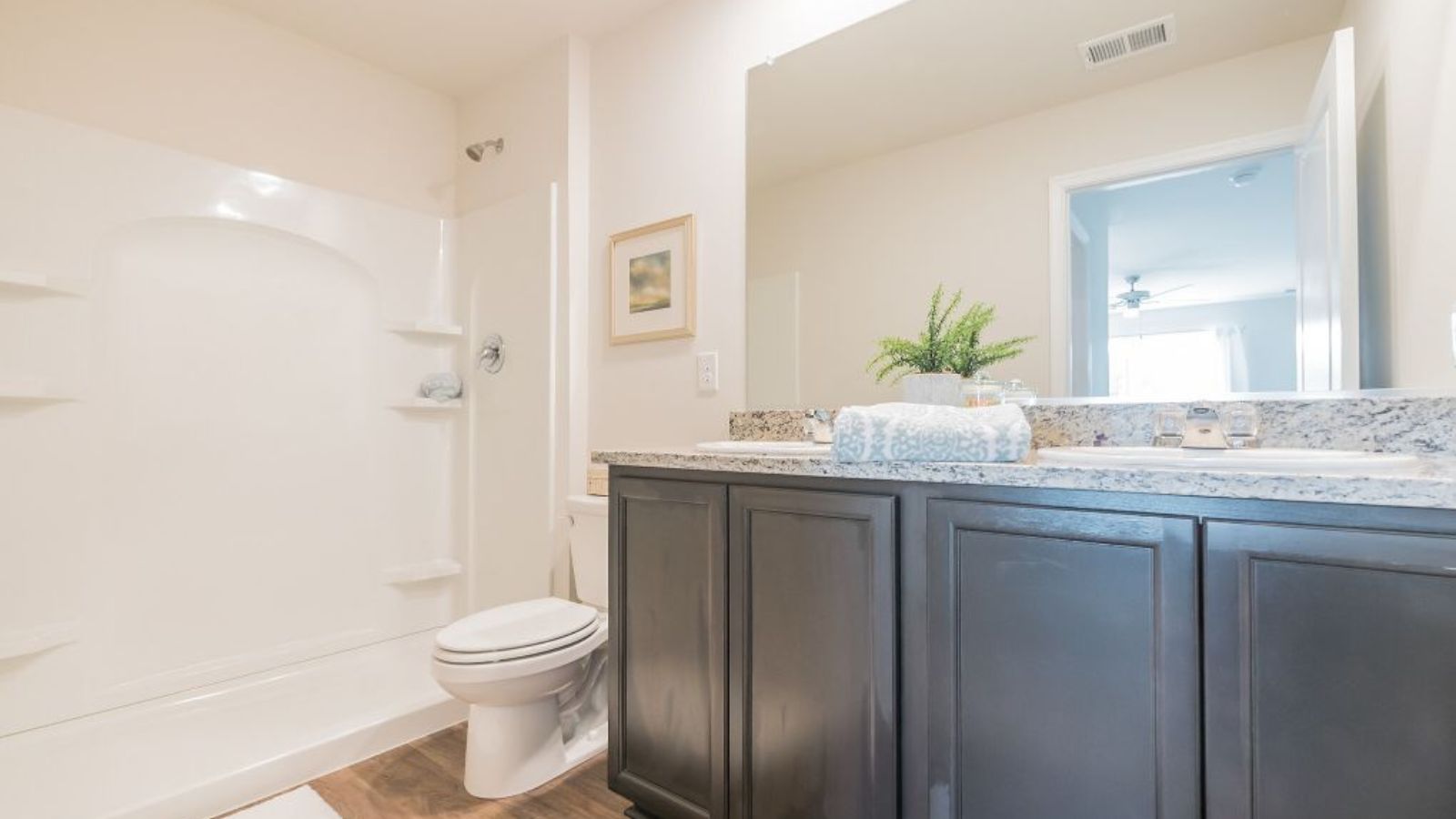 primary full bathroom with dual sink vanity