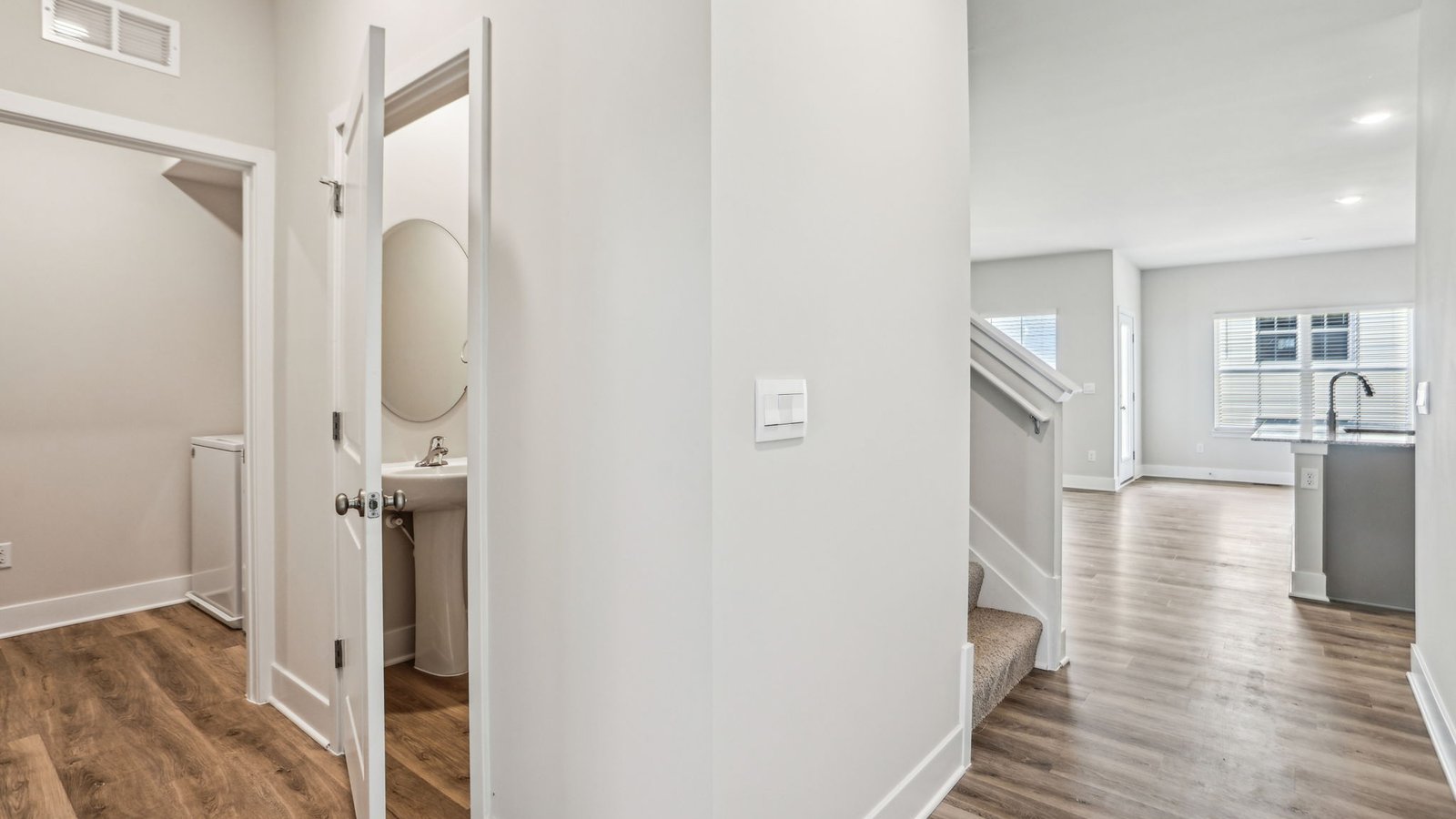 Laundry and powder rooms are located along the foyer