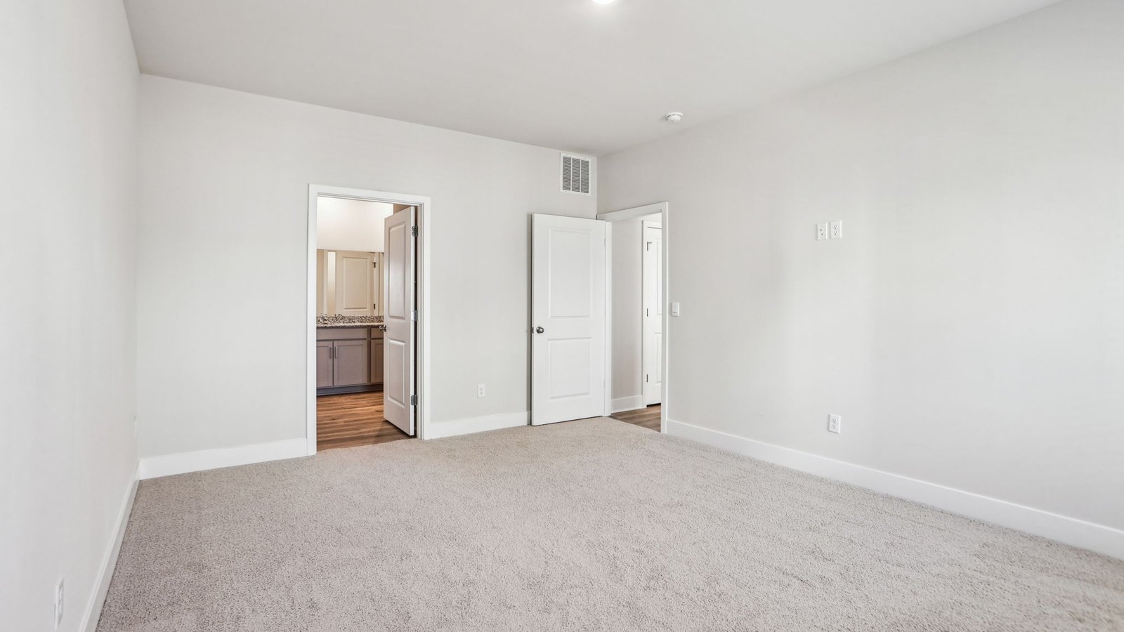 primary bedroom opens into full bath