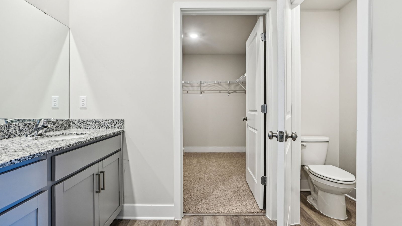 Primary bathroom opens directly into a walk-n closet