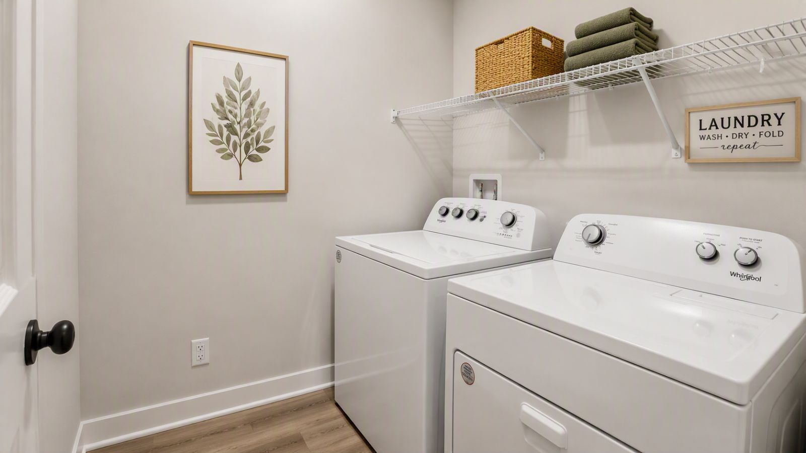 Convenient laundry room in a Winchester VA single-family home featuring storage space, utility area, and functional everyday design.