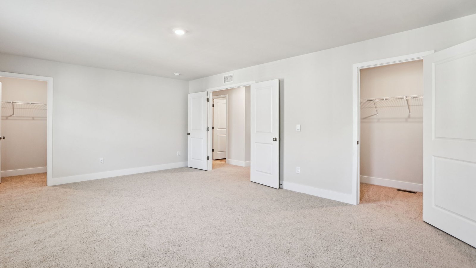 primary bedroom with double closets