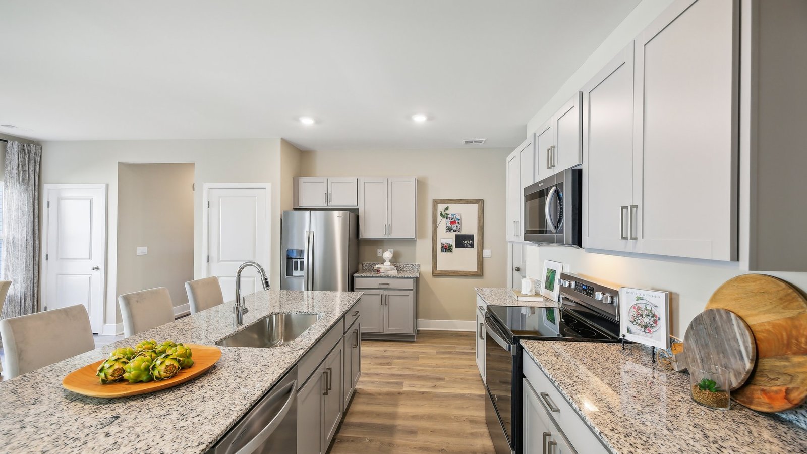 Beautiful stone grey kitchen cabinets and stainless steel appliances