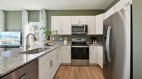 Kitchen comes equipped with stainless steel appliances