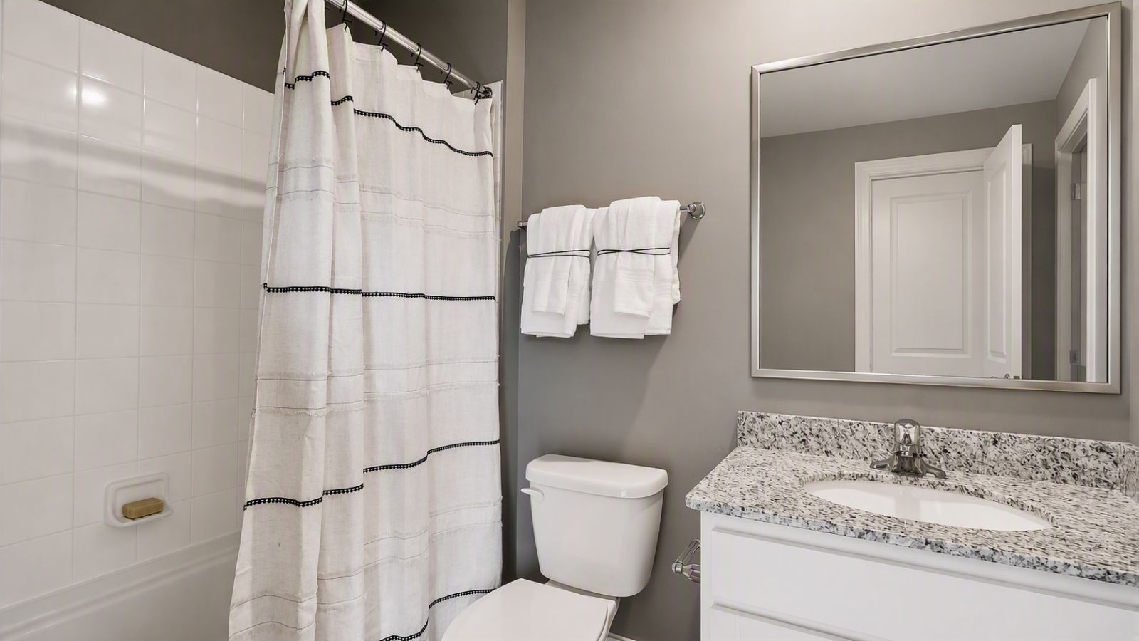 Full bathroom with modern finishes and vanity in a new construction townhome in Winchester VA.