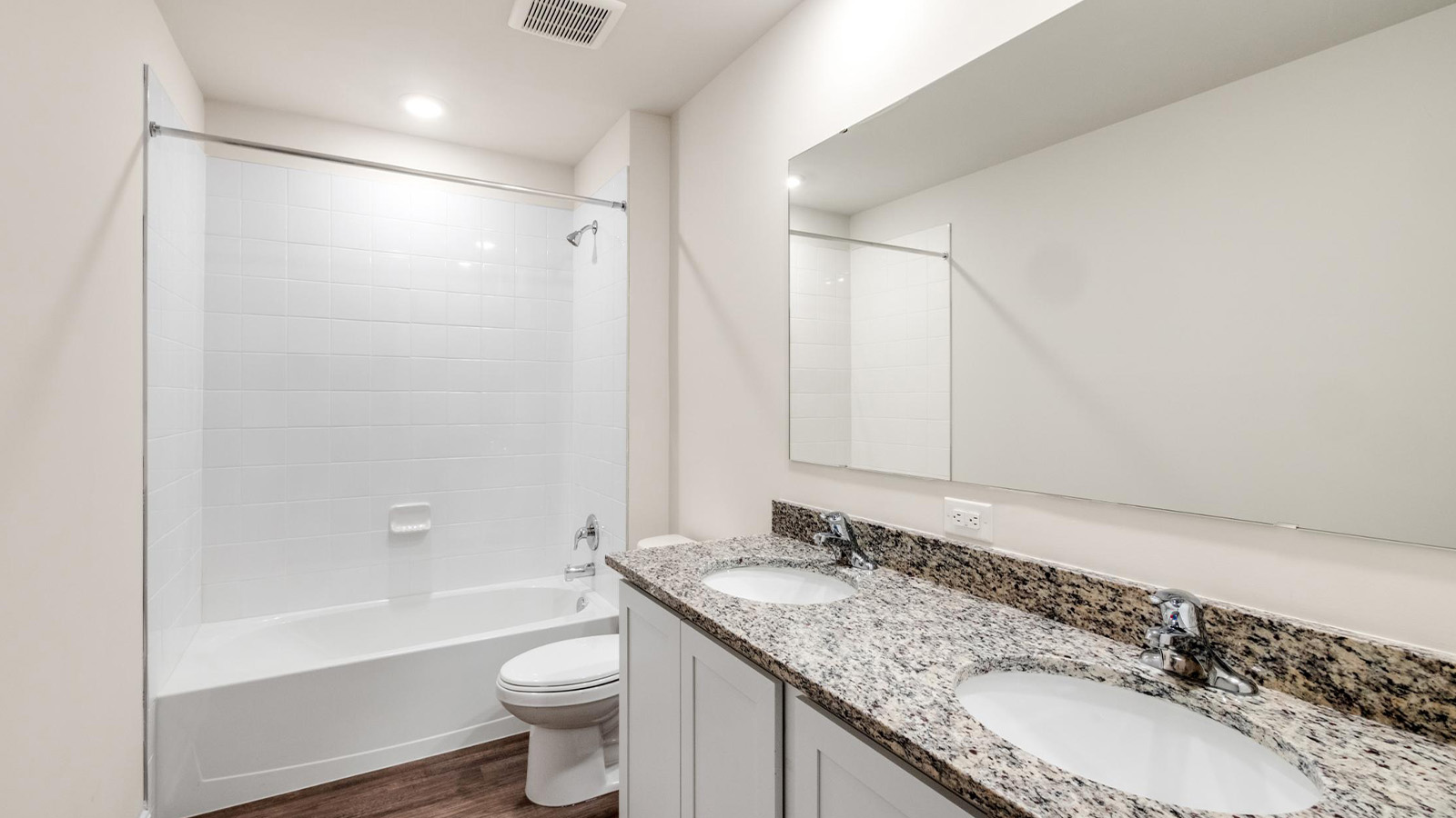 primary bathroom with dual sink vanity