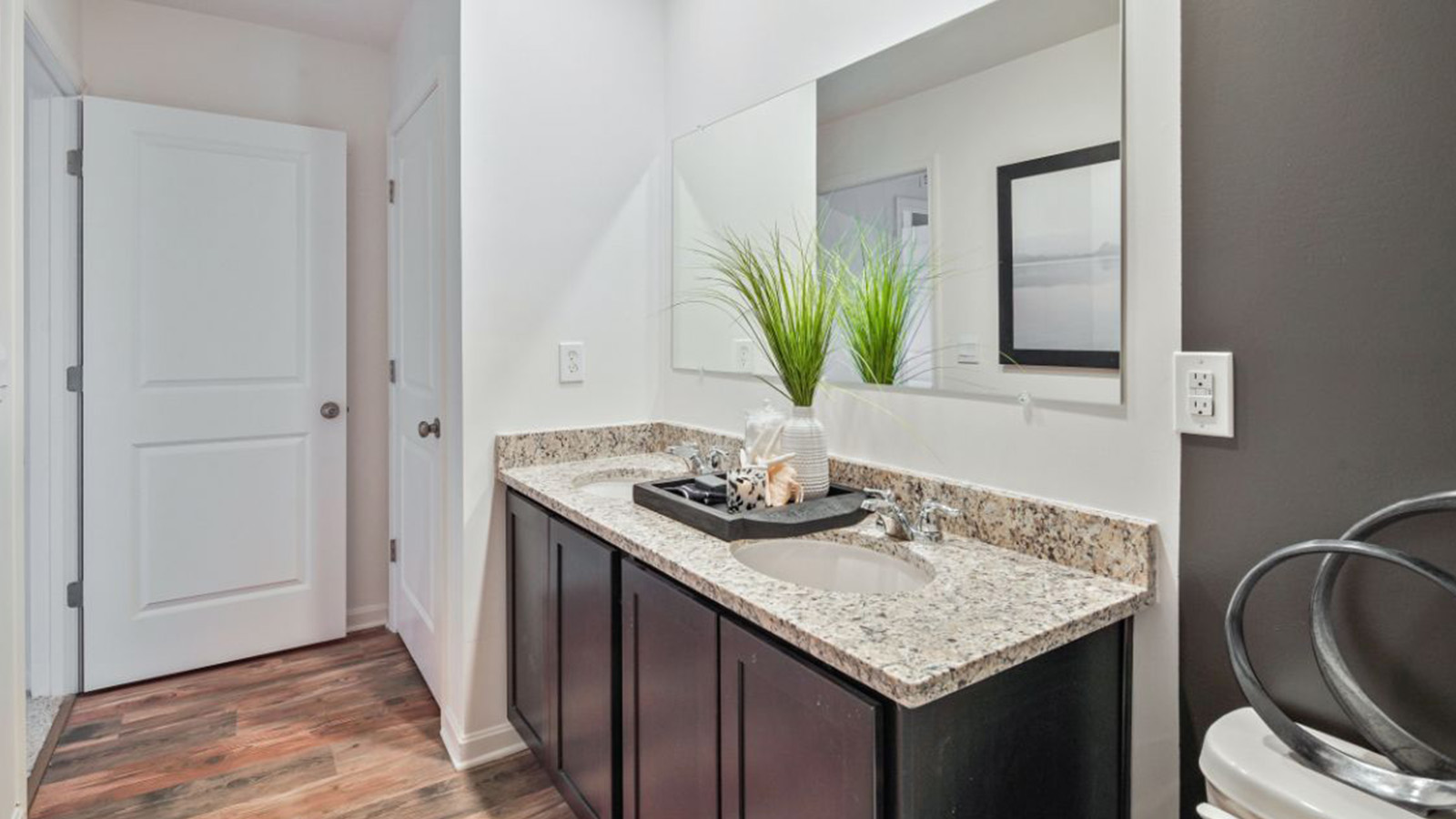 secondary bathroom features a double vanity