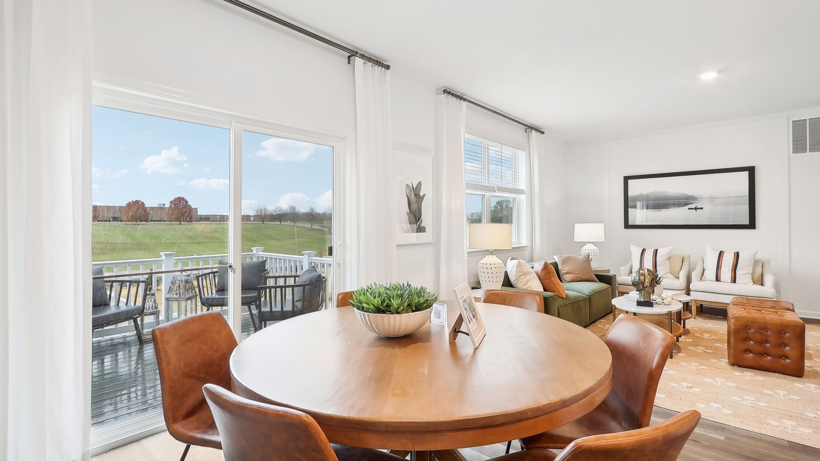 Dining area overlooks the balcony and the backyard