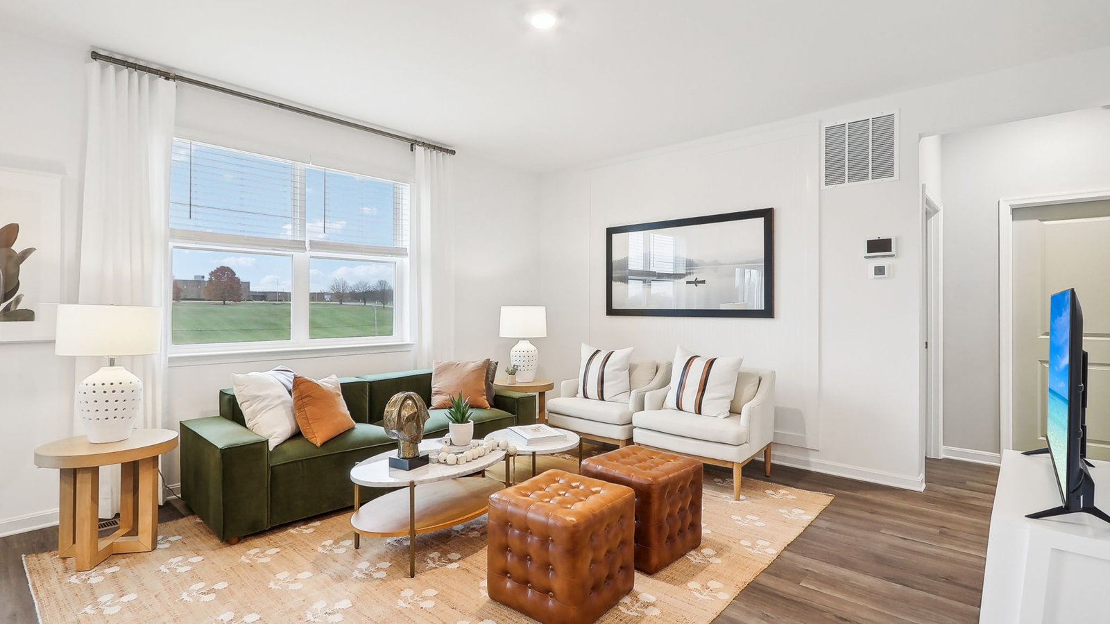open concept living area with windows and natural lighting
