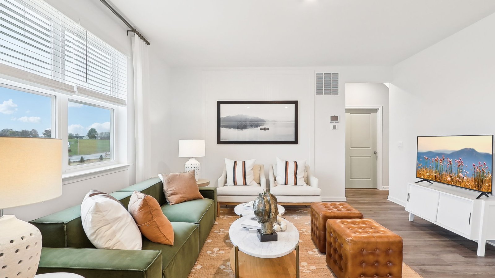 open concept living area with windows and natural lighting