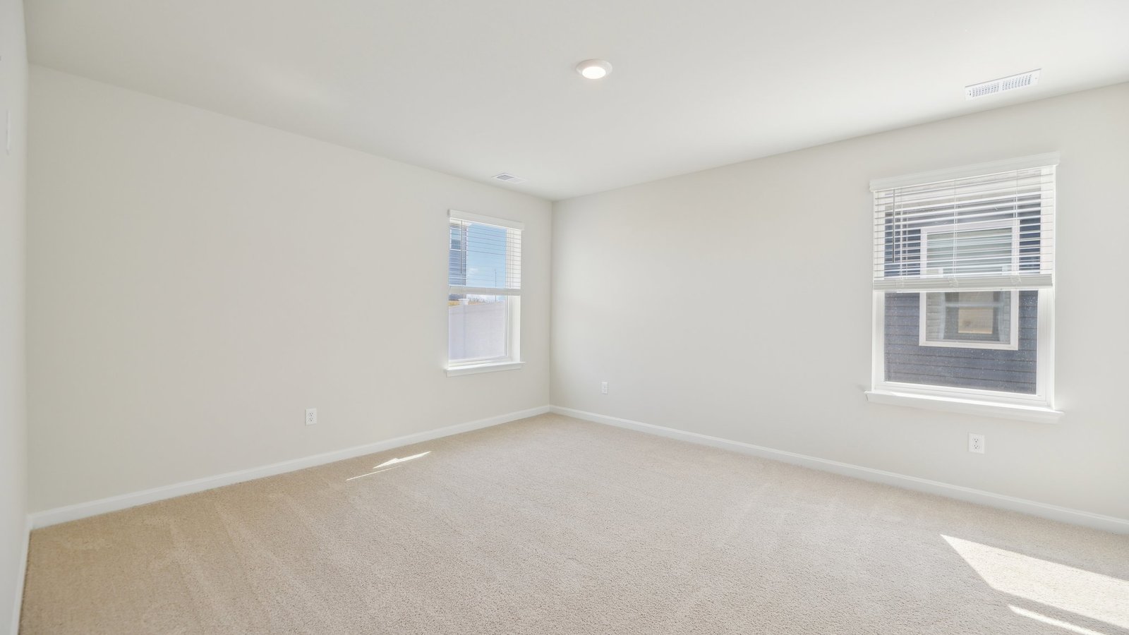 primary bedroom with lots of natural lighting