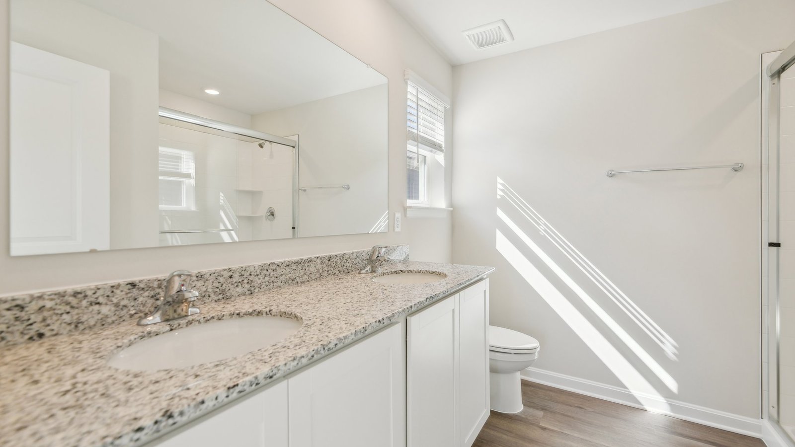 primary bathroom with dual sink vanity