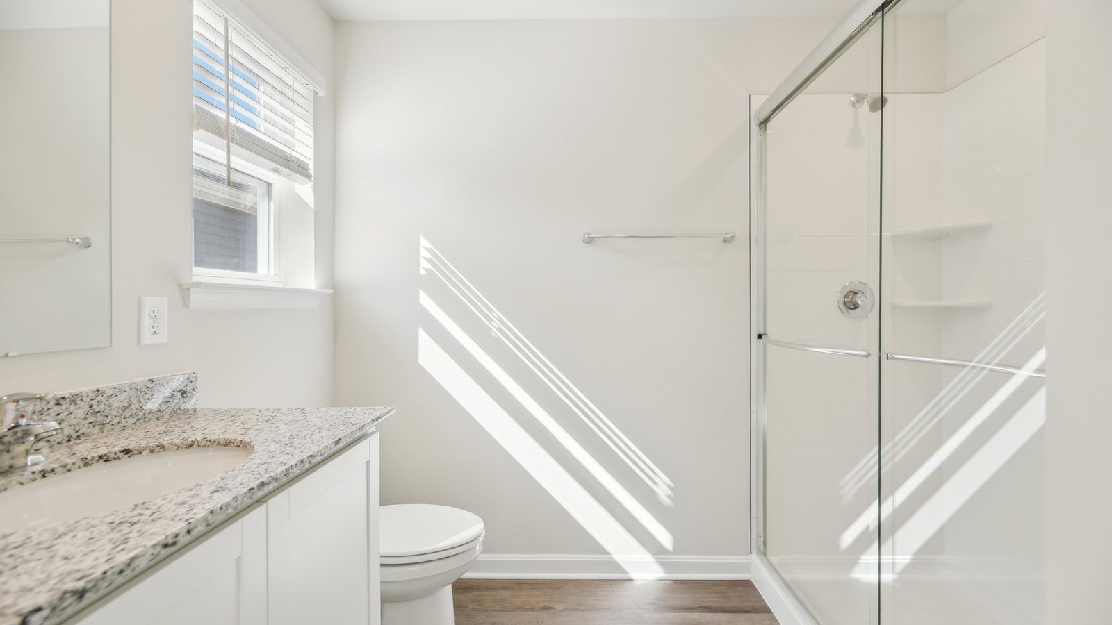 primary bathroom with dual sink vanity