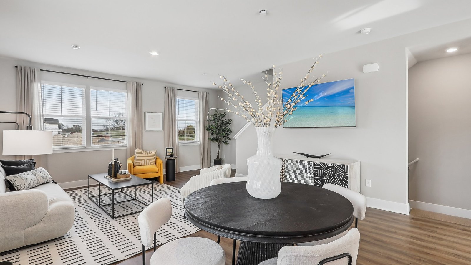 open concept living dining and kitchen