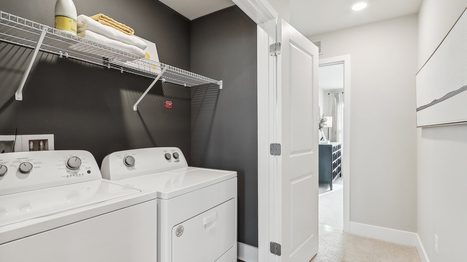 laundry area with storage