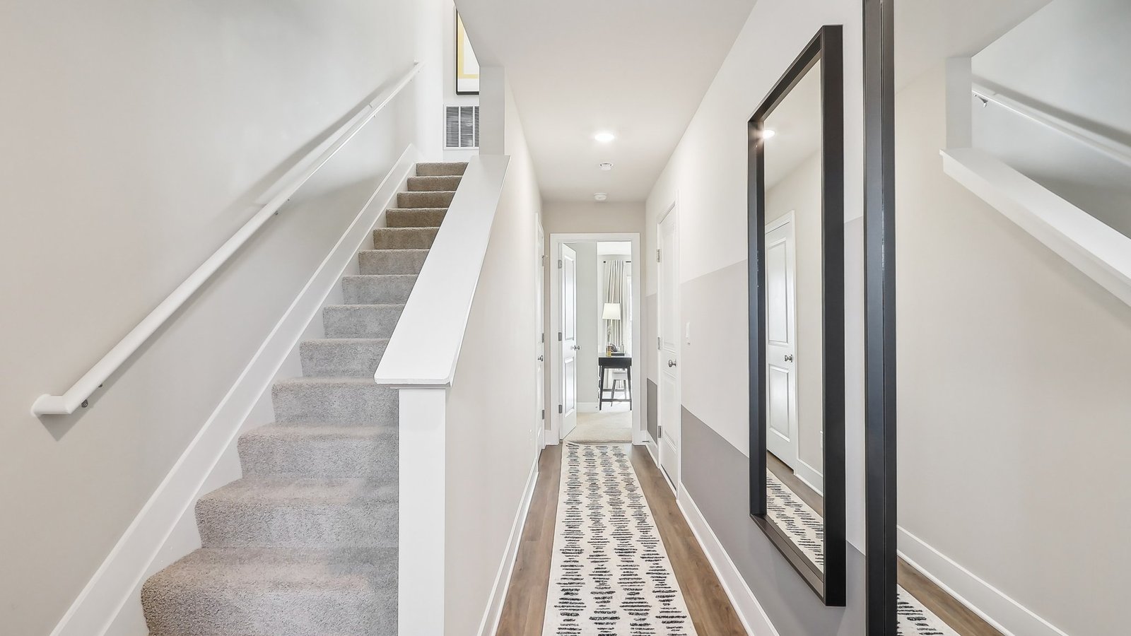 Standing just inside the front door, the stairs are to your left