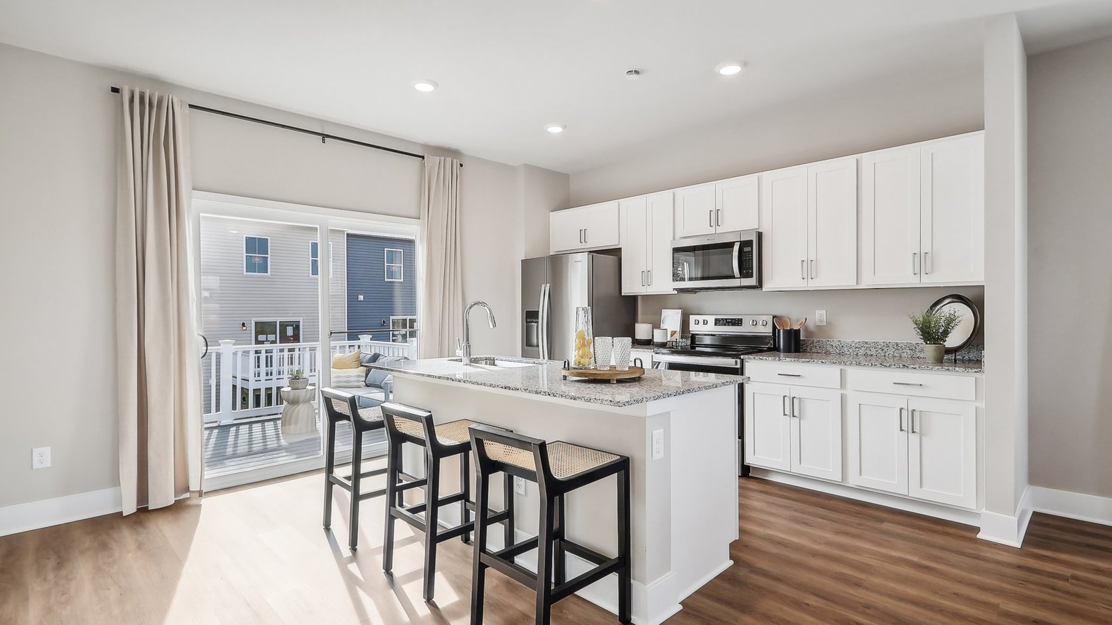 Large glass door lead from kitchen to the deck