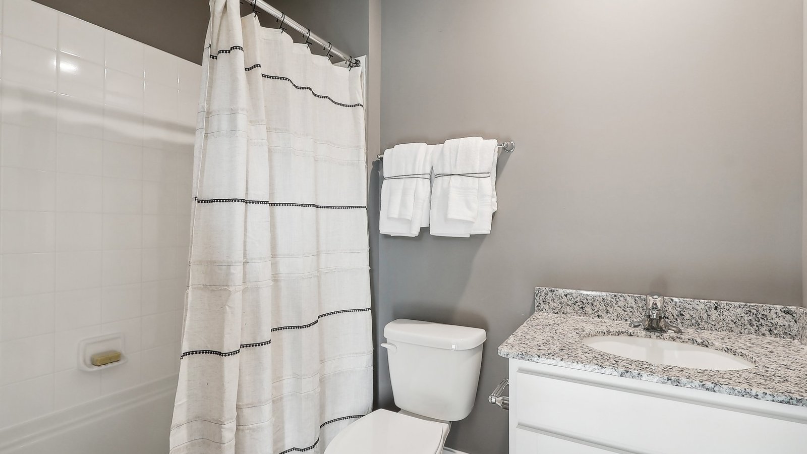 Downstairs bathroom with a tub