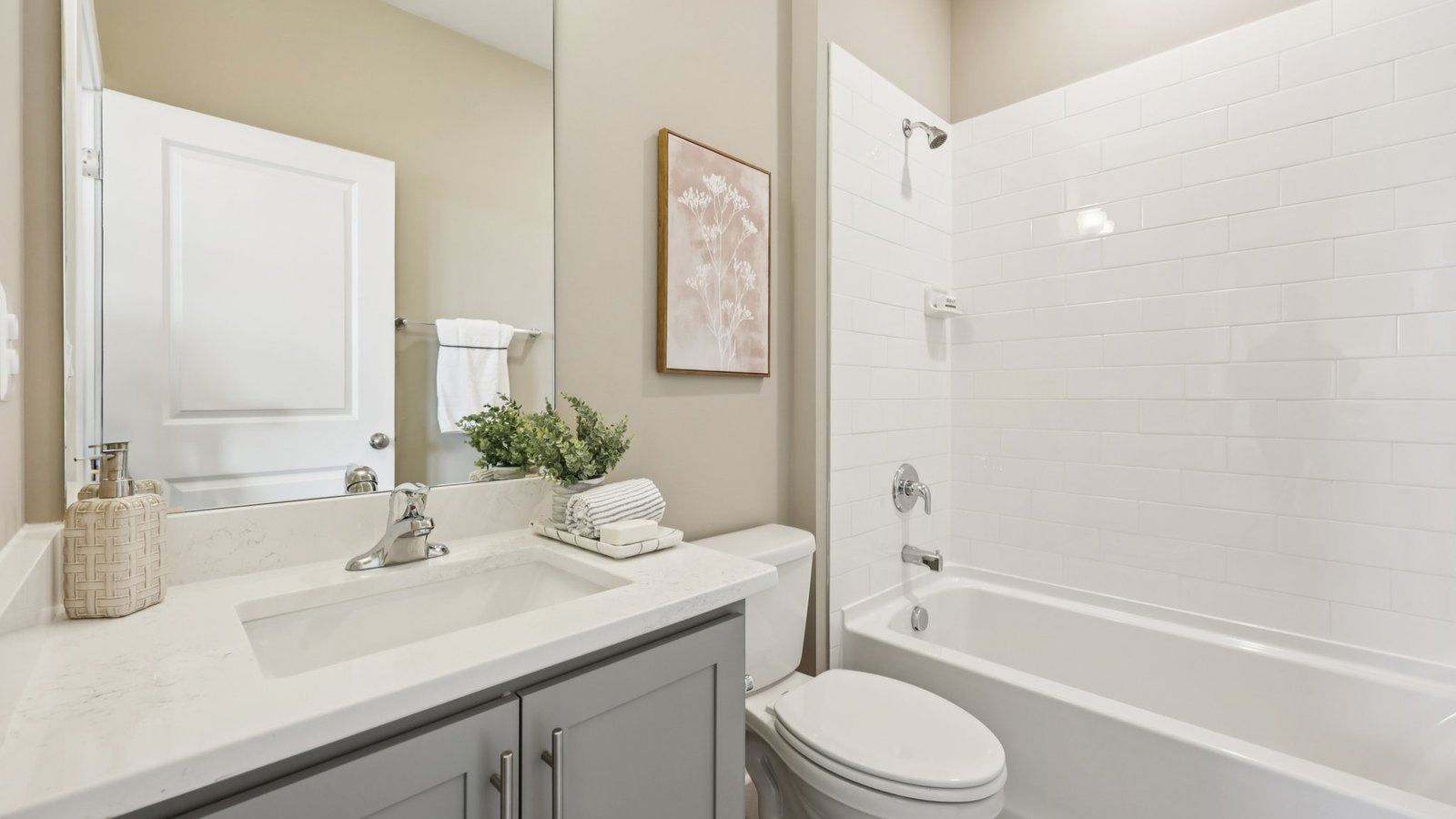 Secondary upstairs bathroom with a tub