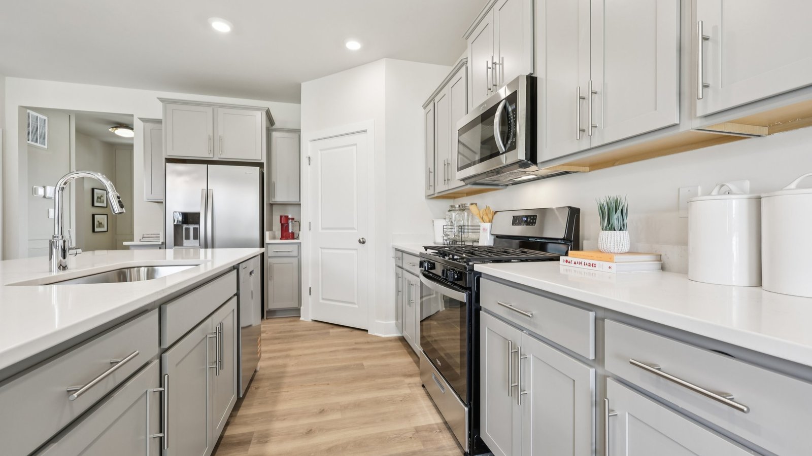 The kitchen features upgraded cabinets and stainless steel appliances
